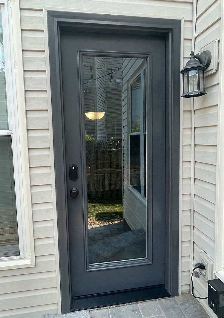 new black entry door with big glass on a house in Tennessee installed by windows for life