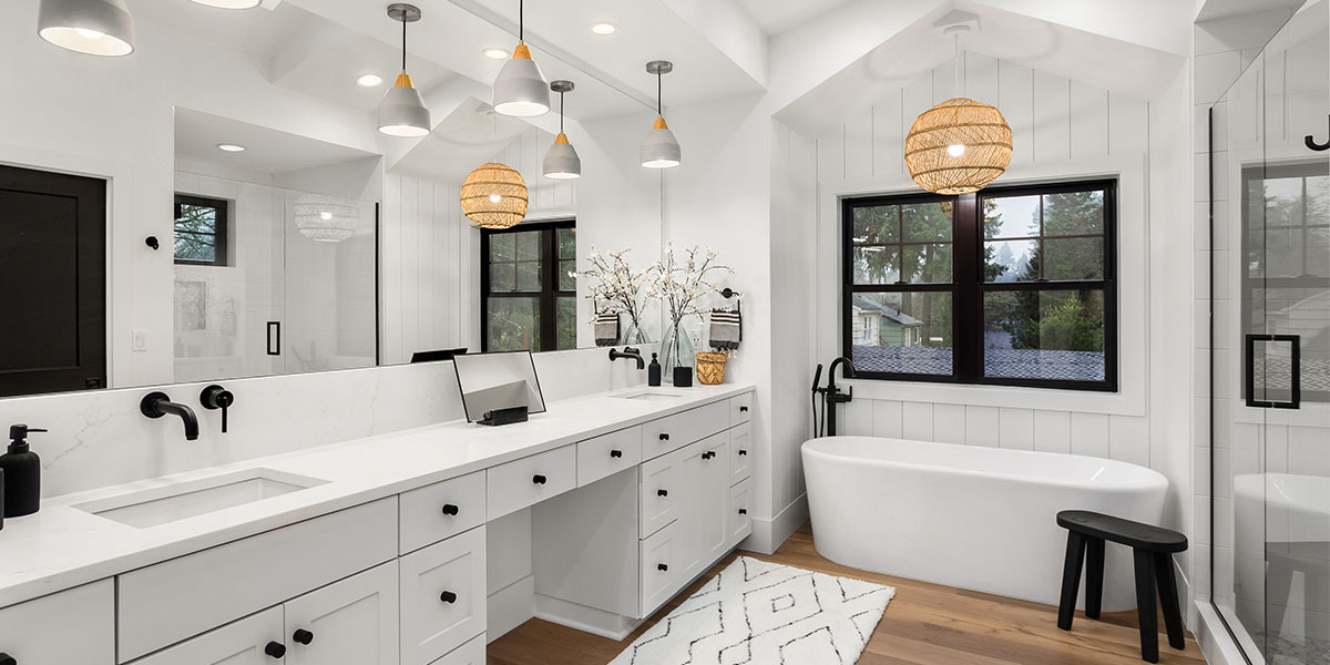 Modern bathroom with white finishes and black windows