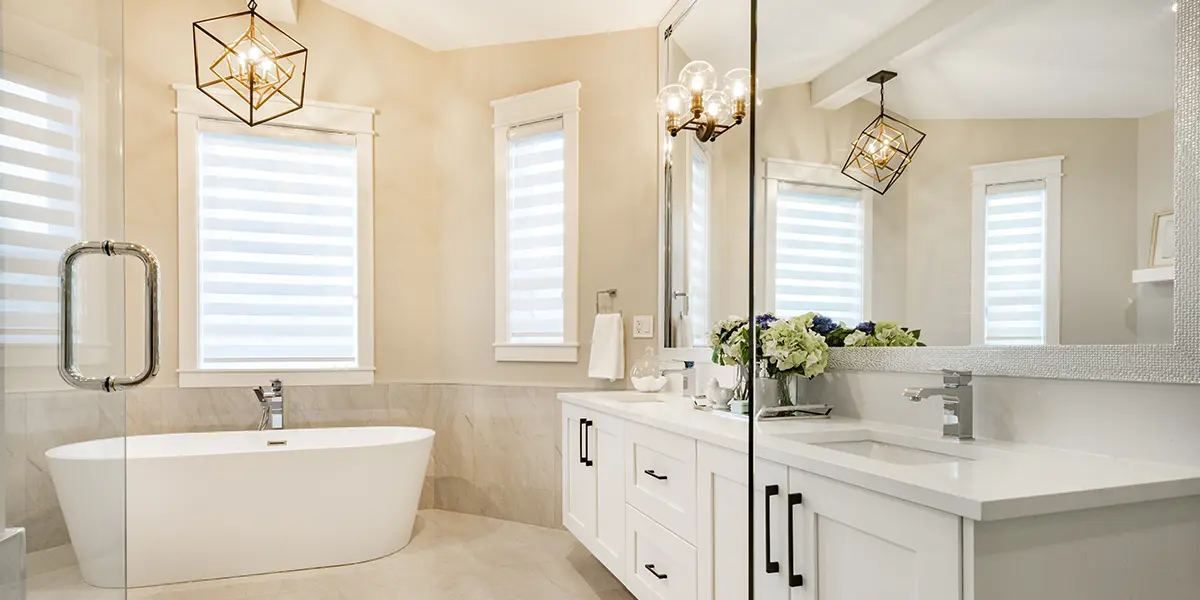 Large windows with shutters in newly renovated bathroom