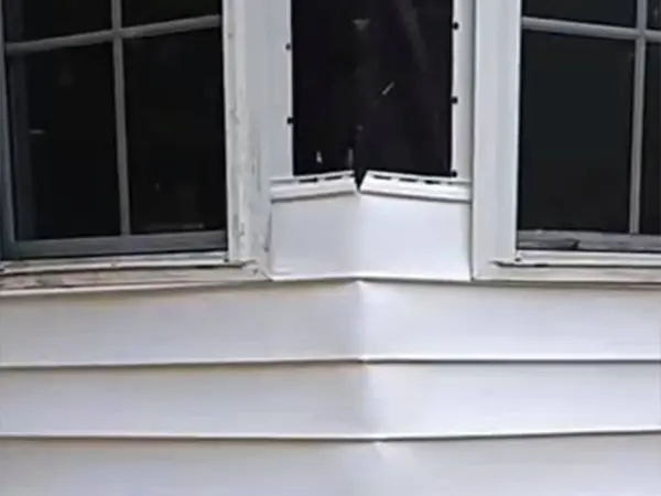 Poor window frame and siding installation