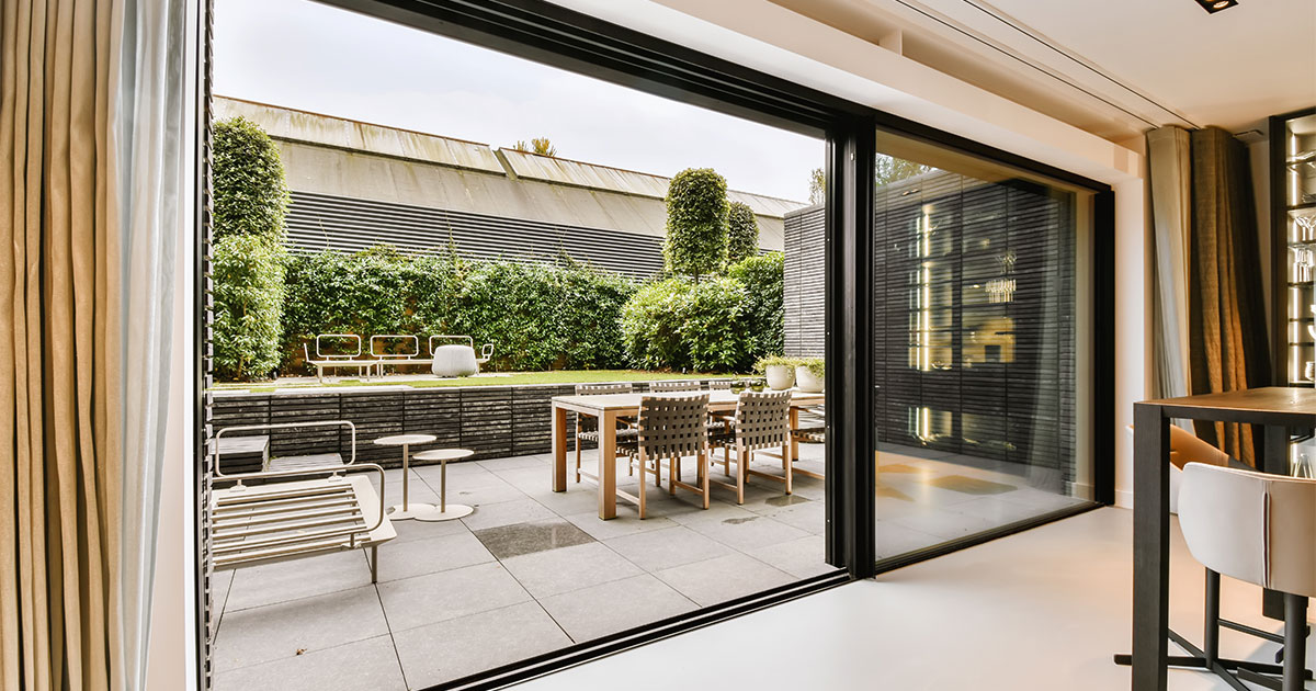 Large french doors that leads to the backyard