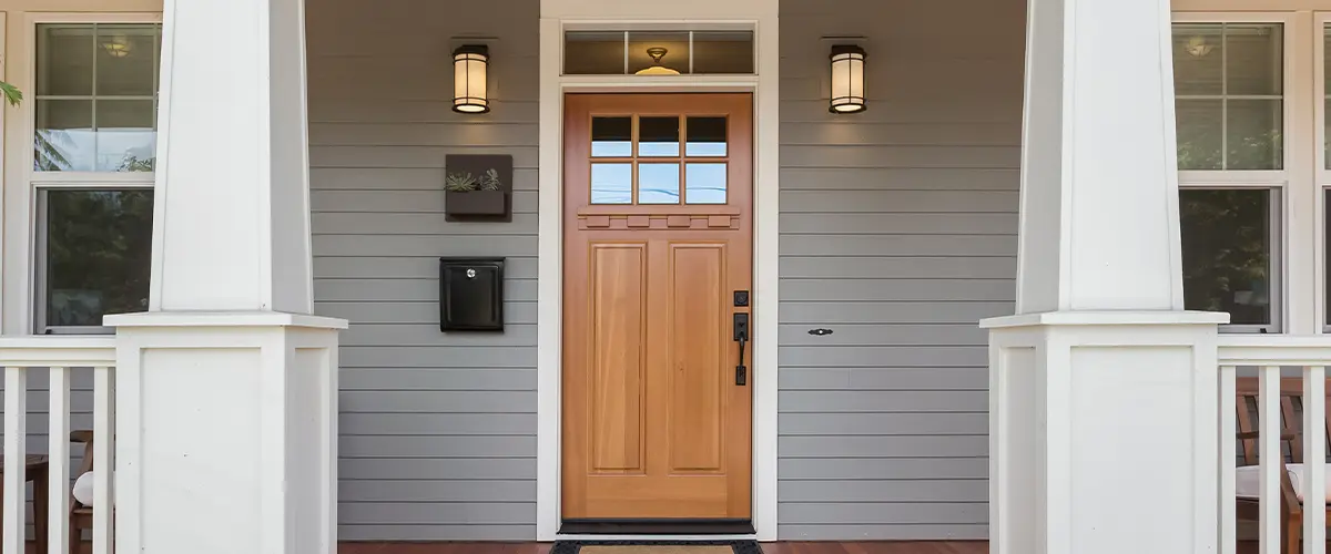 front house with brown wood door for showcasing door installation services