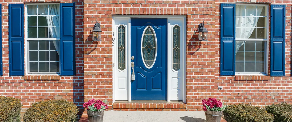 Blue Fiberglass Door And Windows Front of House