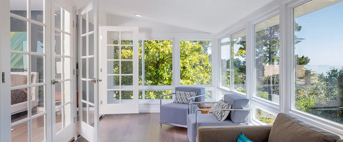 Bright solarium-style sunroom off the master suite. Vinyl vs. Fibrex Windows