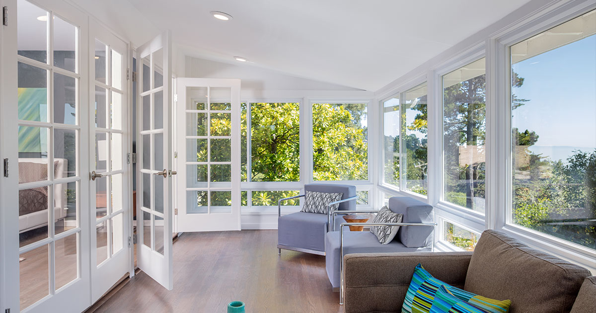 Bright solarium-style sunroom off the master suite.