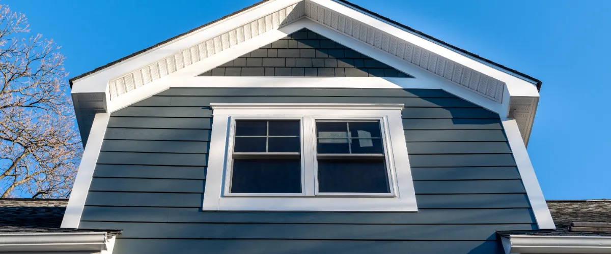 a house exterior with double hung windows