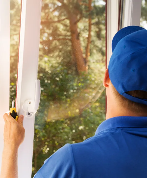 a person installing a new window handle